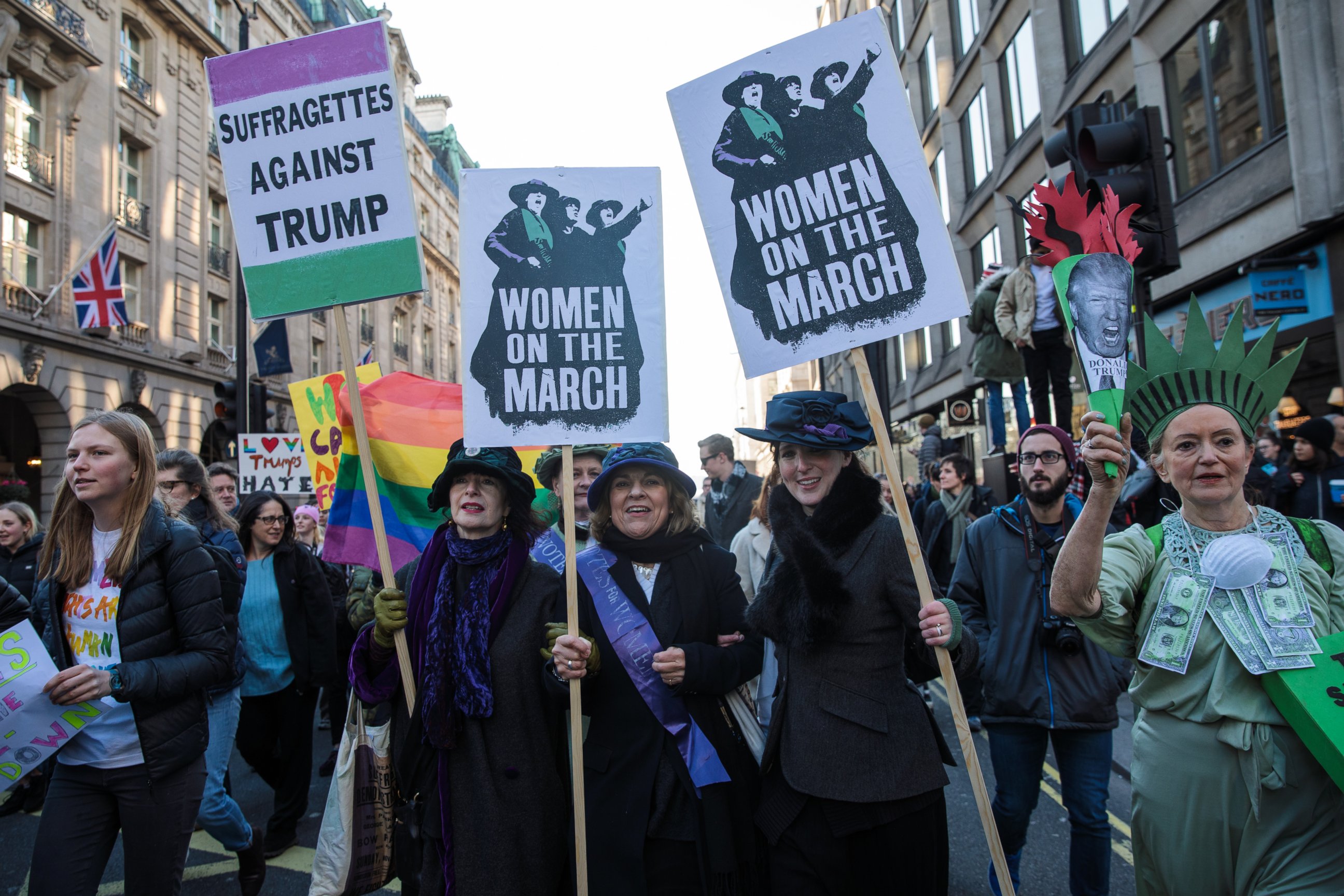 PHOTO: Protesters in costume holding placards march from The US Embassy in Grosvenor Square towards Trafalgar Square during the Women's March, Jan. 21, 2017, in London, England.