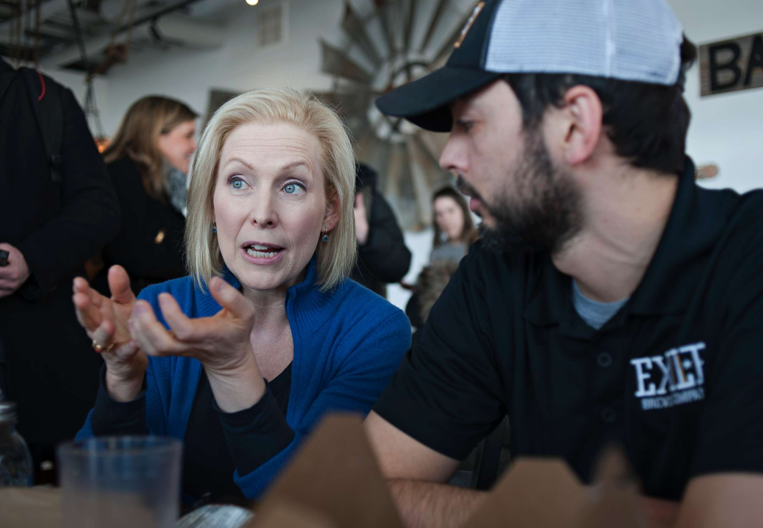PHOTO: Senator Kirsten Gillibrand (D-NY) speaks with patrons at the Scenic Route Bakery in the East Village of Des Moines, Iowa, Jan. 19, 2019, after she spoke at the third annual Women's March at the Iowa State Capitol.
