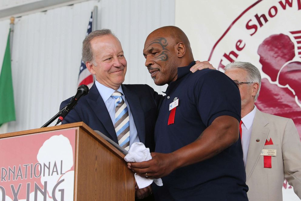 PHOTO: Mike Tyson speaks about inductee Jim Gray during the parade of champions at the International Boxing Hall of Fame for the Weekend of Champions induction event, June 10, 2018, in Canastota, N.Y. 