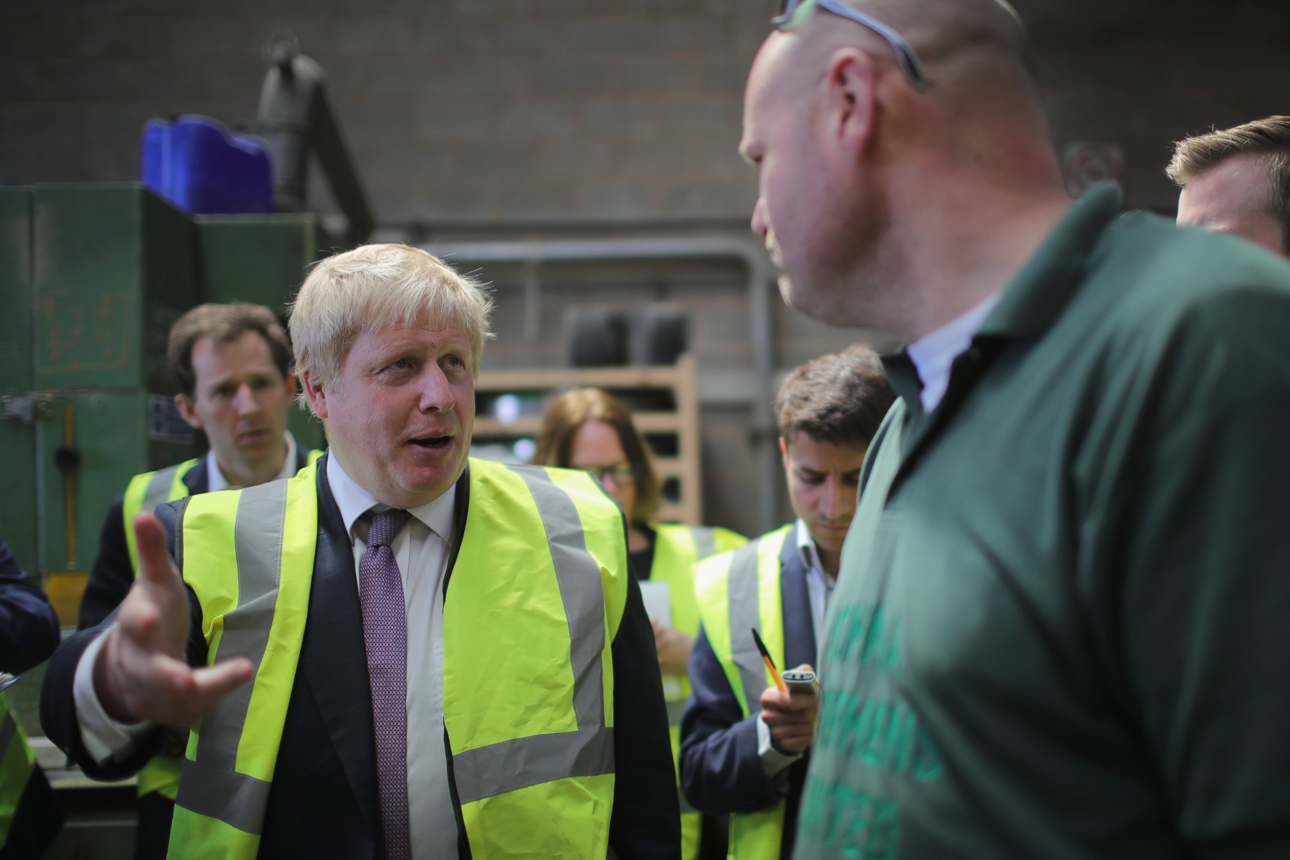 PHOTO: Boris Johnson, the former mayor of London chats to workers during a visit to John A. Stephens Ltd, May 16, 2016, in Nottingham, England.