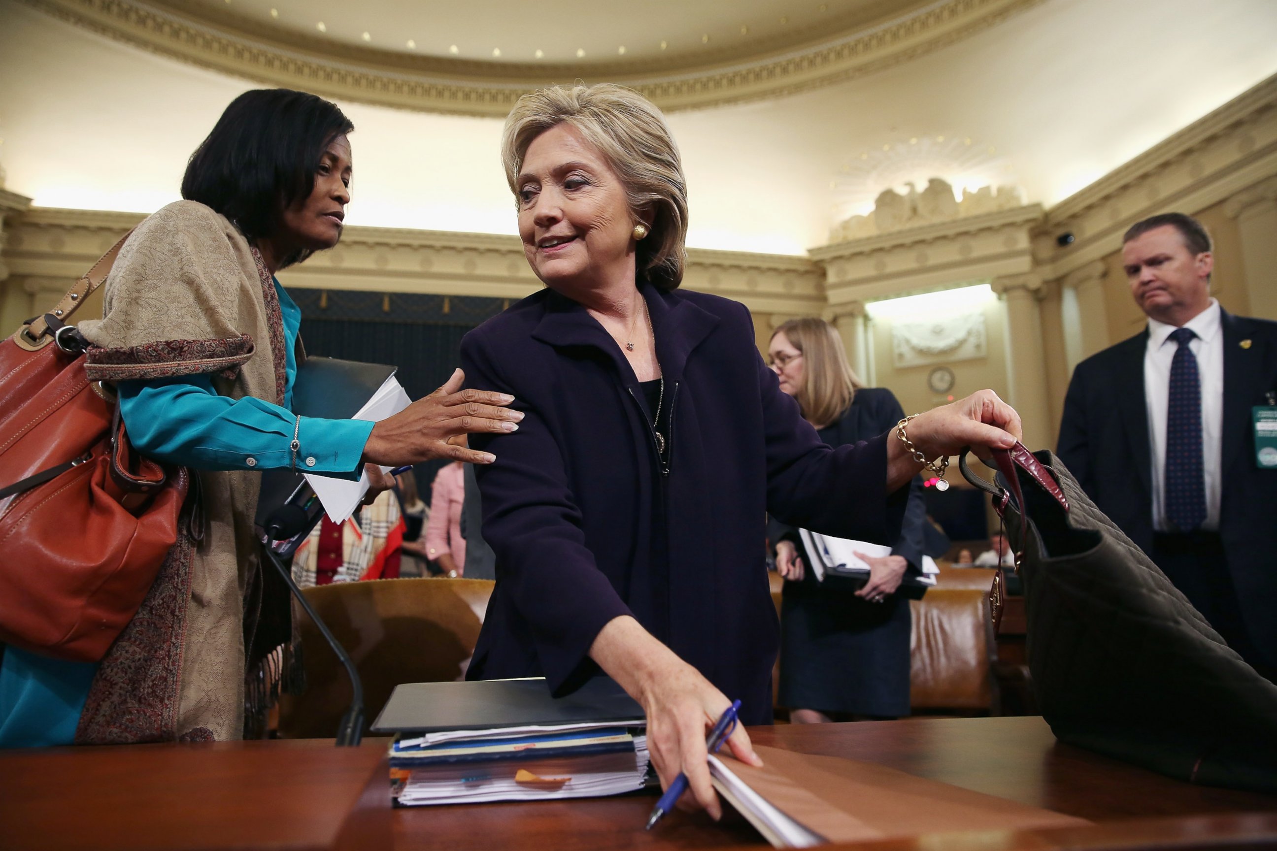 PHOTO: Cheryl Mills (L) and Hillary Clinton take a break in a hearing of the House Select Committee on Benghazi, Oct. 22, 2015, on Capitol Hill in Washington. 
