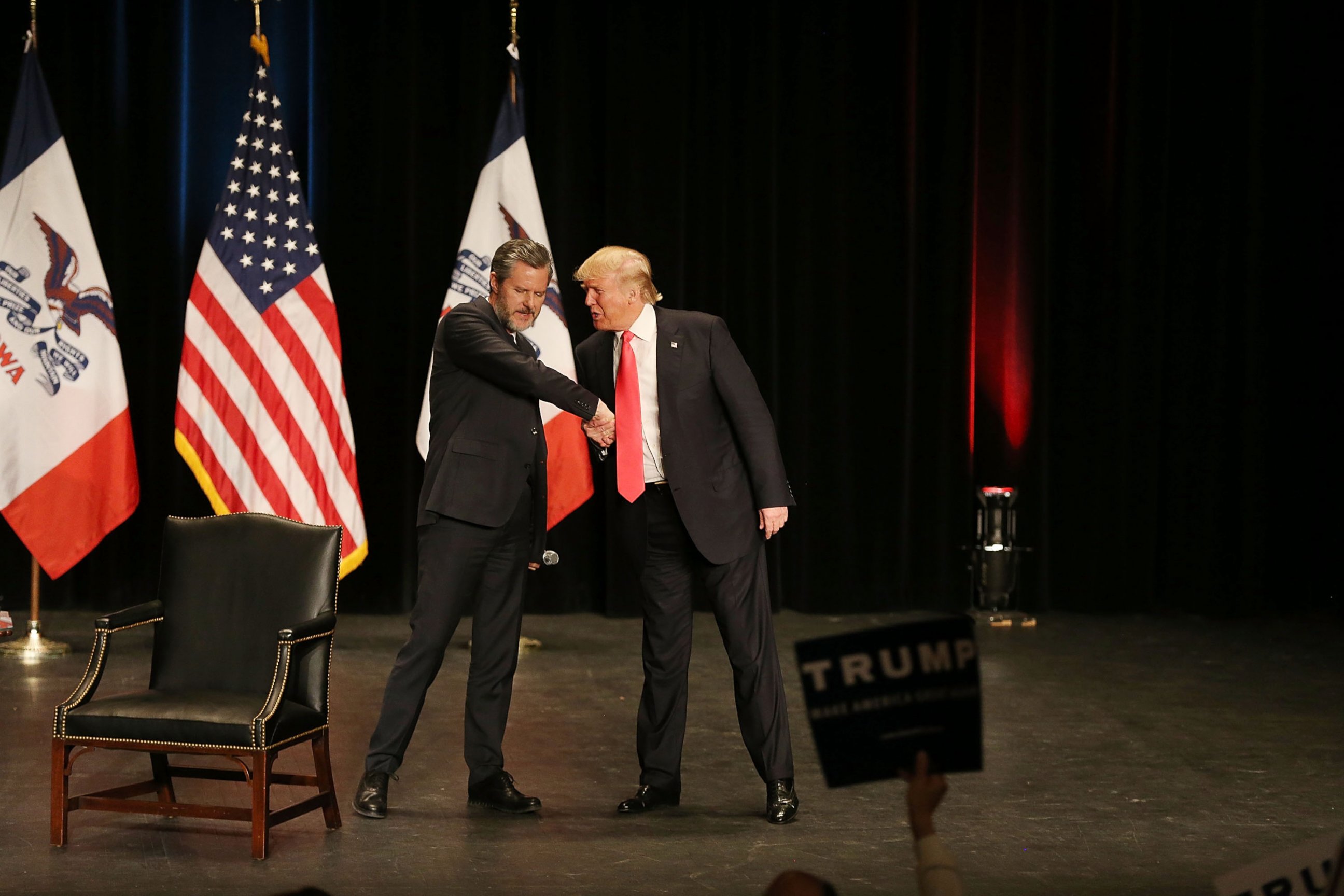 PHOTO: Jerry Falwell Jr., left, greets Donald Trump, right, as he walks on stage during a campaign rally at the Sioux City Orpheum Theatre, Jan. 31, 2016, in Sioux City, Iowa.