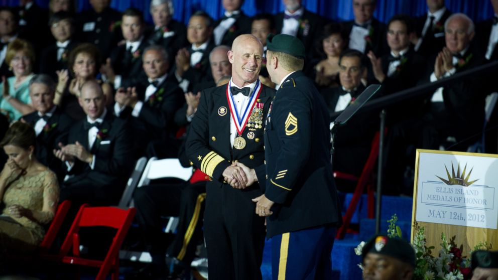 PHOTO: U.S. Navy Vice Adm. Robert S. Harward receives the Ellis Island Medal of Honor Award from a U.S. Army Special Forces soldier during a ceremony, May 12, 2012, at Ellis Island in New York.