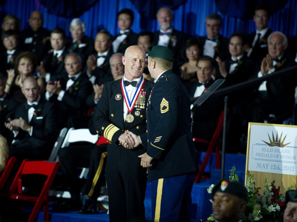 PHOTO: U.S. Navy Vice Adm. Robert S. Harward receives the Ellis Island Medal of Honor Award from a U.S. Army Special Forces soldier during a ceremony, May 12, 2012, at Ellis Island in New York.