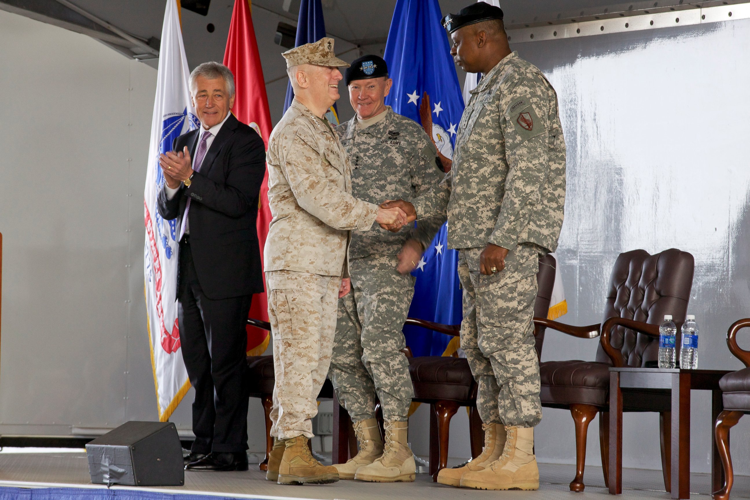 PHOTO: U.S. Marine Corps Gen. James N. Mattis, left foreground, shakes hands with Army Gen. Lloyd J. Austin III during the U.S. Central Command change of command ceremony March 22, 2013, at MacDill Air Force Base, Fla.