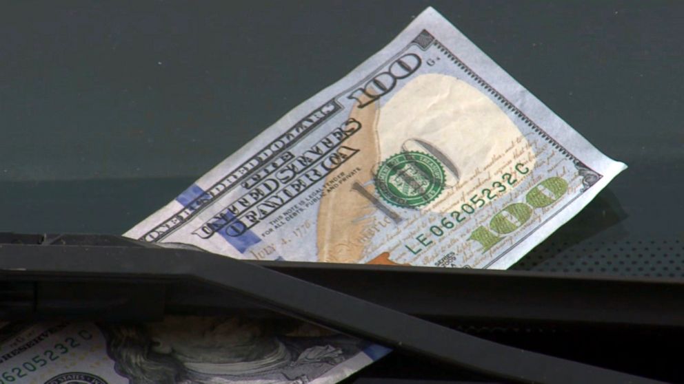 If you see a $100 bill on your windshield, don’t immediately try to retrieve it. 