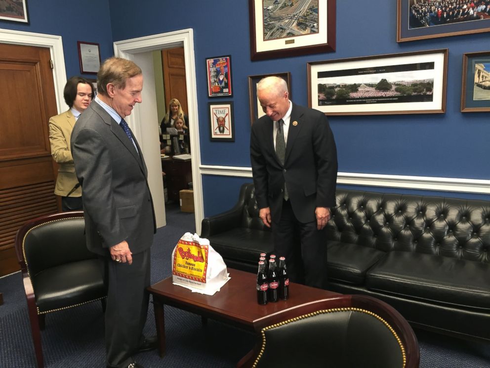PHOTO: Rep. Robert Pittenger, R-North Carolina, delivers on his Super Bowl wager with Rep. Mike Coffman, R-Coloardo. 