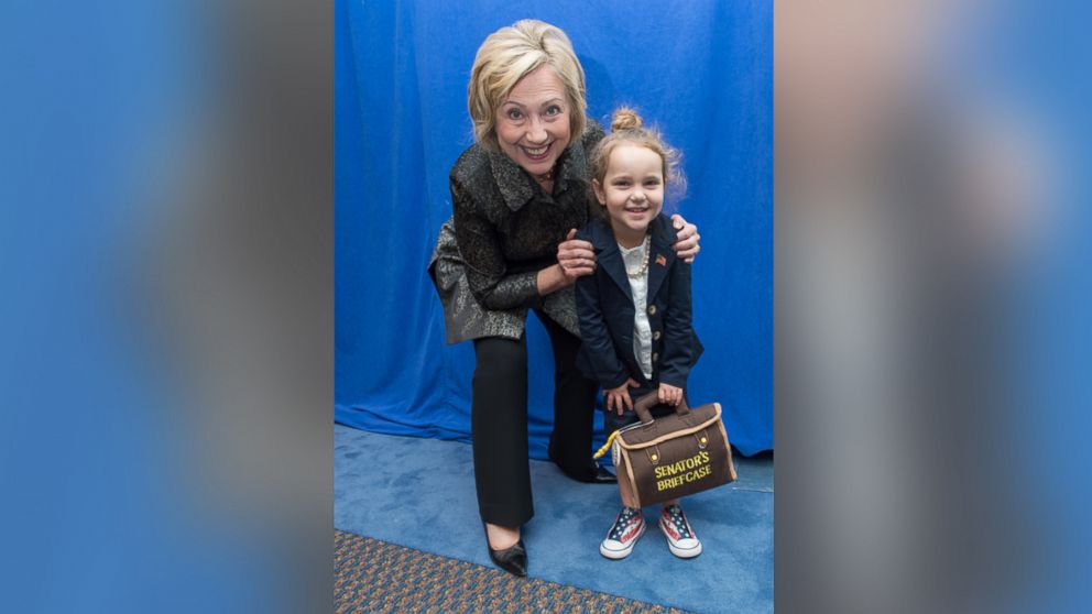 Democratic presidential candidate Hillary Clinton poses with 4-year-old Sullivan Wood, who dressed as the former secretary of state for Halloween, in Charleston, S.C., Oct. 31, 2015.