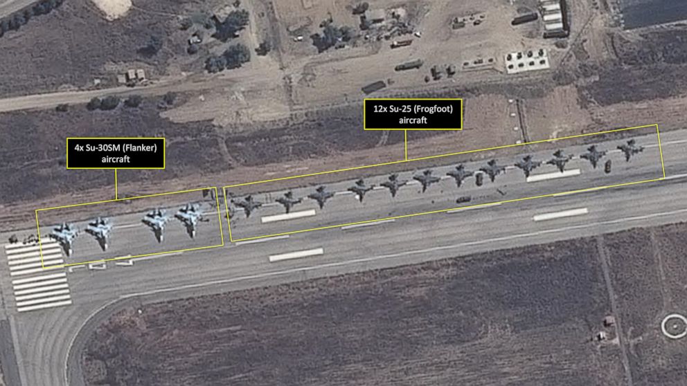 PHOTO: This satellite image taken on September 20 and released by AllSource Analysis four SU-30 "Flanker" fighters and 12 SU-25 "Frogfoot" fighters can be seen on a runway at the Bassel Al-Assad International Airport in Latakia, Syria.