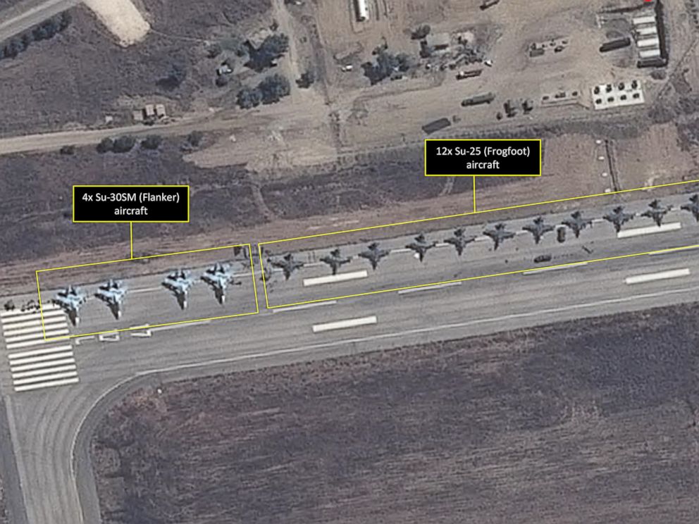 PHOTO: This satellite image taken on September 20 and released by AllSource Analysis four SU-30 "Flanker" fighters and 12 SU-25 "Frogfoot" fighters can be seen on a runway at the Bassel Al-Assad International Airport in Latakia, Syria.
