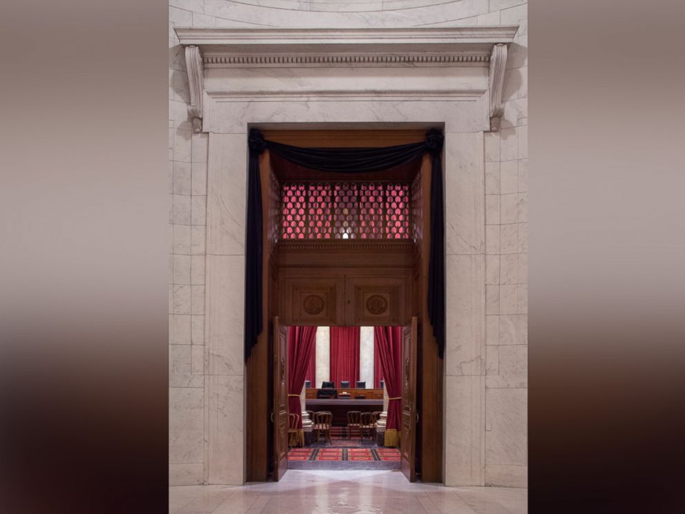 PHOTO: The Courtroom of the Supreme Court showing Associate Justice Antonin Scalia's bench chair and the bench in front of his seat draped in black following his death on Feb. 13, 2016.  
