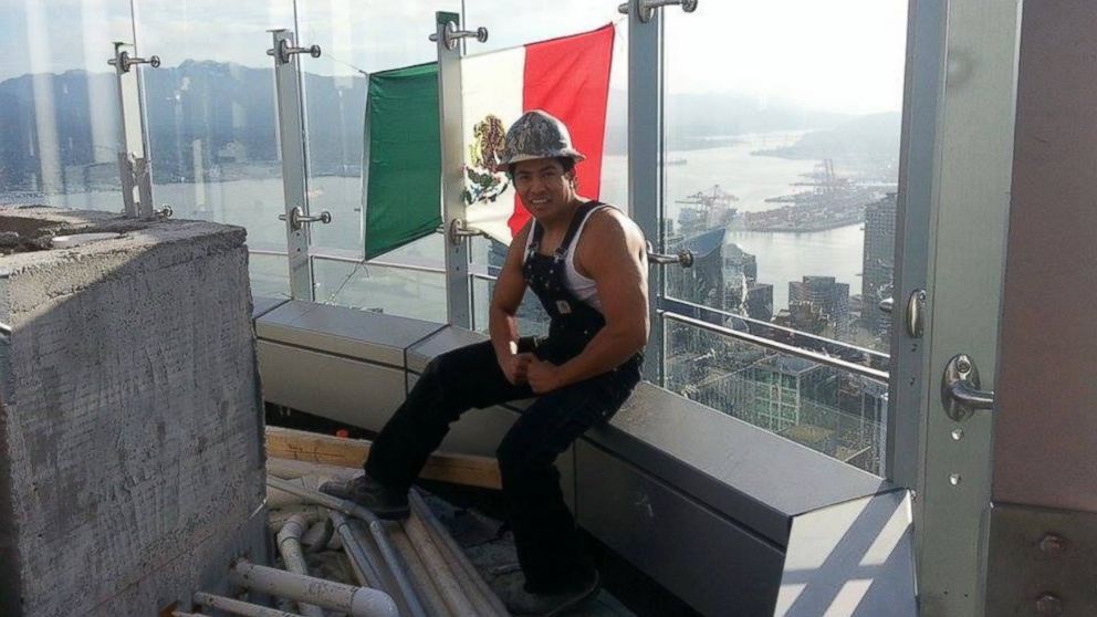 PHOTO: This image of a Mexican flag and a worker on top of Trump International Hotel and Tower Vancouver was posted to Diego Saul Reyna's Facebook page, April 2, 2016.