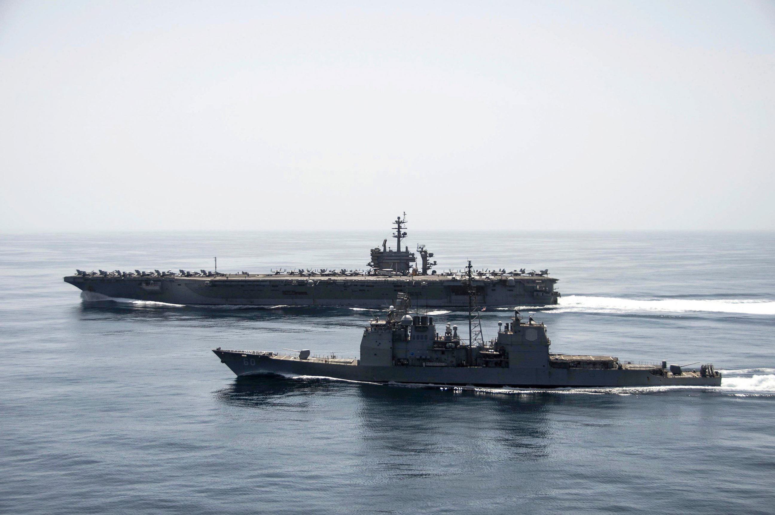 PHOTO: The aircraft carrier USS Theodore Roosevelt (CVN 71) and the guided-missile cruiser USS Normandy (CG 60) operate in the Arabian Sea conducting maritime security operations.