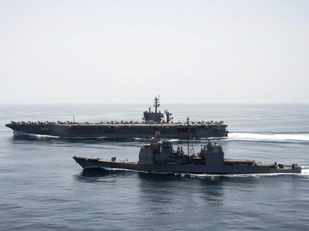 PHOTO: The aircraft carrier USS Theodore Roosevelt (CVN 71) and the guided-missile cruiser USS Normandy (CG 60) operate in the Arabian Sea conducting maritime security operations.