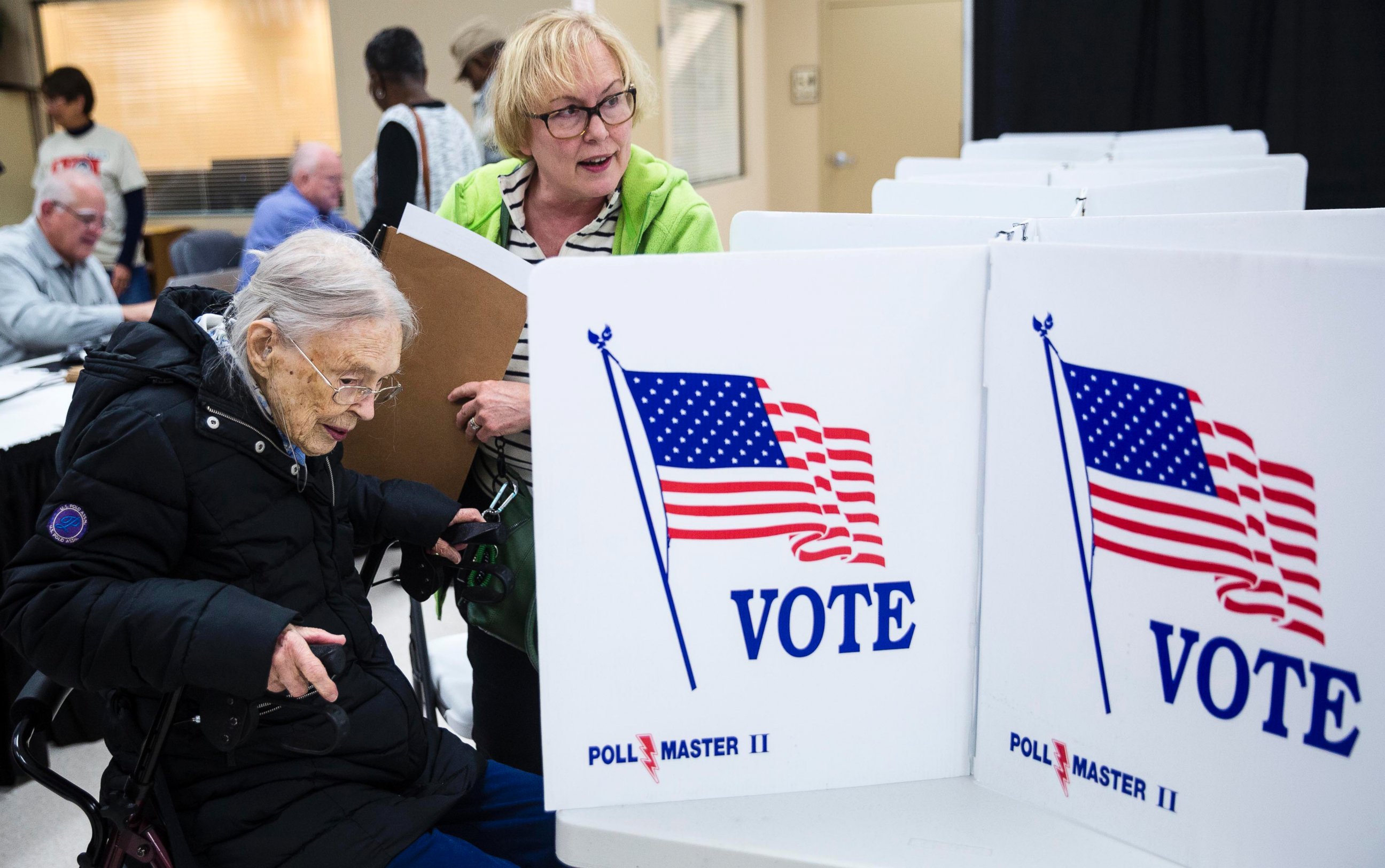 PHOTO: Rosemary Milburn, right, helps her mother Garvin Colburn cast her ballot during early voting at the Hamilton County Election Commission on Amnicola Highway, Oct. 22, 2016, in Chattanooga, Tennessee. 