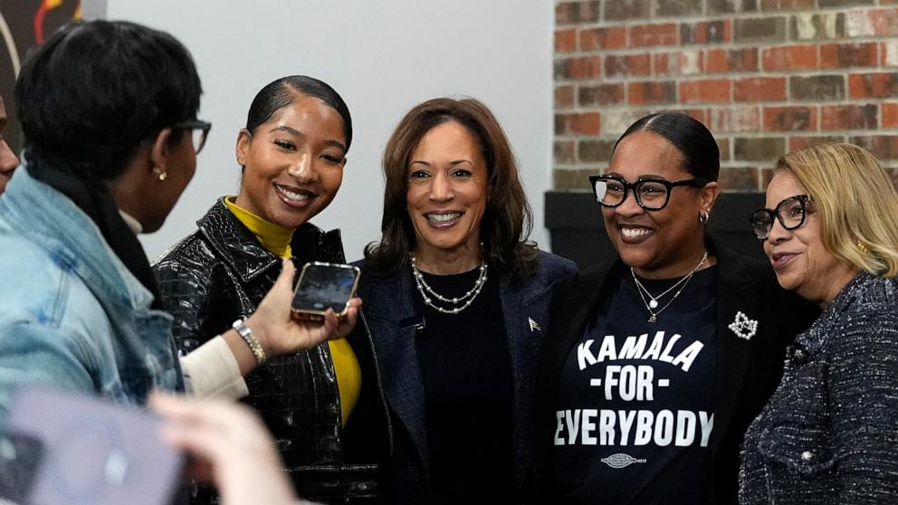 PHOTO: Democratic presidential nominee Vice President Kamala Harris takes a photo with patrons during a campaign stop at Kuzzo's Chicken and Waffles in Detroit, Mich., Nov. 3, 2024. 