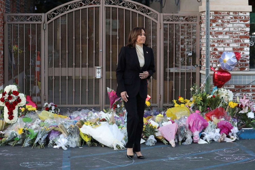 PHOTO: U.S. Vice President Kamala Harris walks after laying a wreath at the entrance of the Star Ballroom Dance Studio after a mass shooting during Chinese Lunar New Year celebrations in Monterey Park, California, U.S.