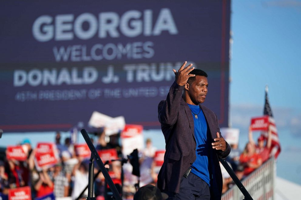 PHOTO: Republican Senate candidate Herschel Walker walks off the stage during a rally featuring former President Donald Trump, Sept. 25, 2021, in Perry, Ga.