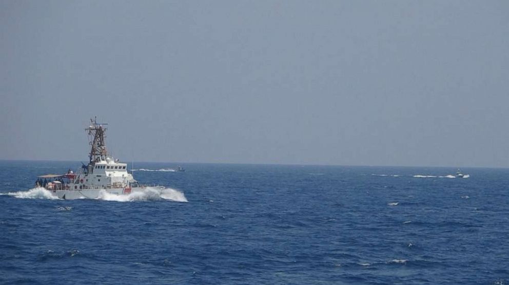 PHOTO: An Iranian Islamic Revolutionary Guard Corps Navy (IRGCN) fast in-shore attack craft (FIAC), a type of speedboat armed with machine guns, speeds near U.S. naval vessels transiting the Strait of Hormuz, Monday, May 10, 2021.