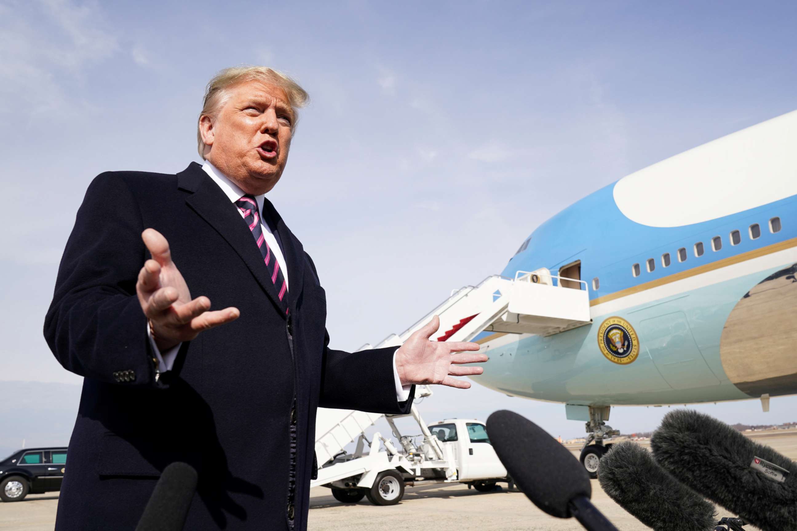 FILE PHOTO: U.S. President Donald Trump talks to reporters prior to boarding Air Force One as he departs Washington for campaign travel to California from Joint Base Andrews in Maryland, U.S., February 18, 2020.