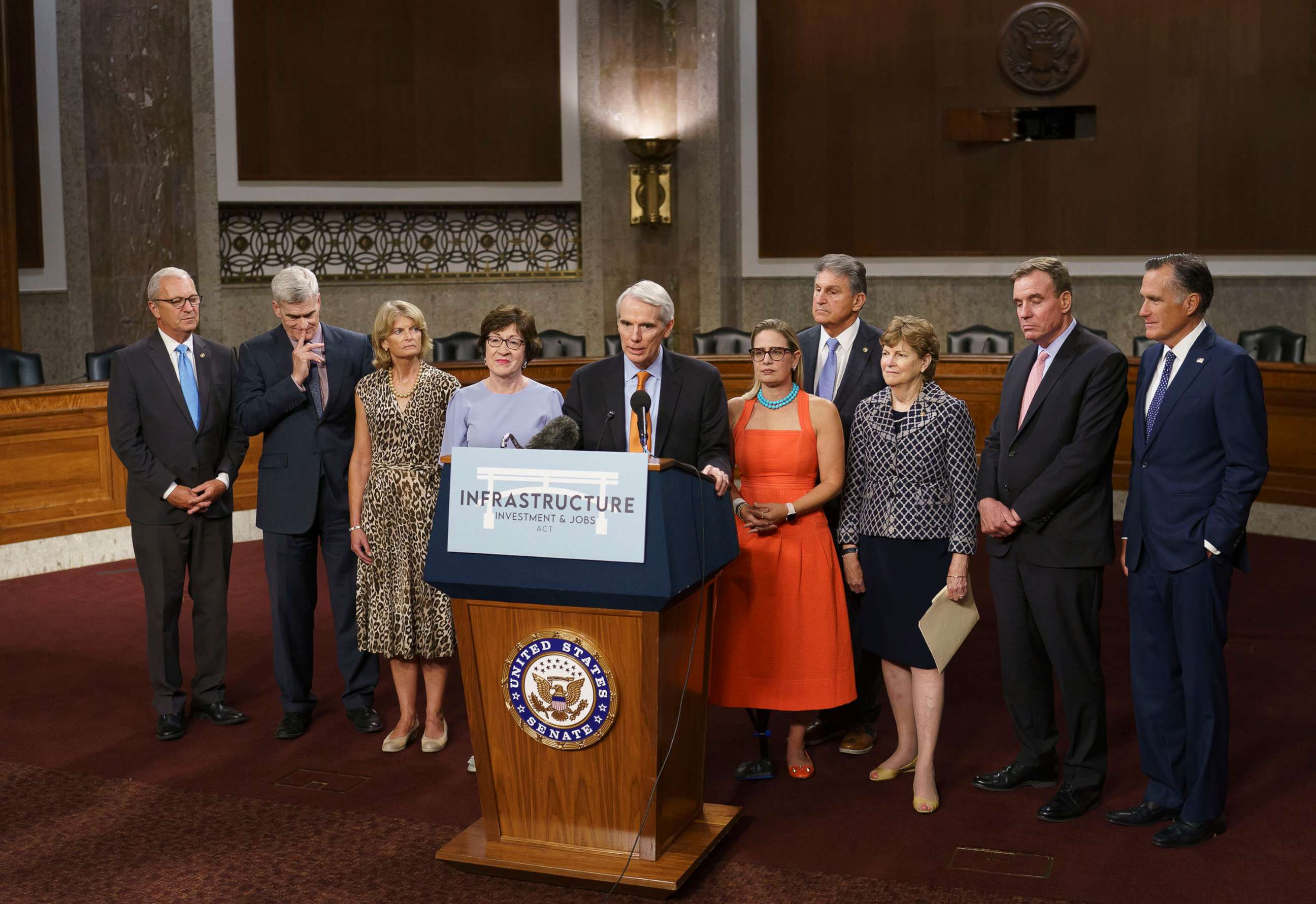 PHOTO: The bipartisan group of Senate negotiators speak to reporters just after a vote to start work on a nearly $1 trillion bipartisan infrastructure package, at the Capitol, July 28, 2021.