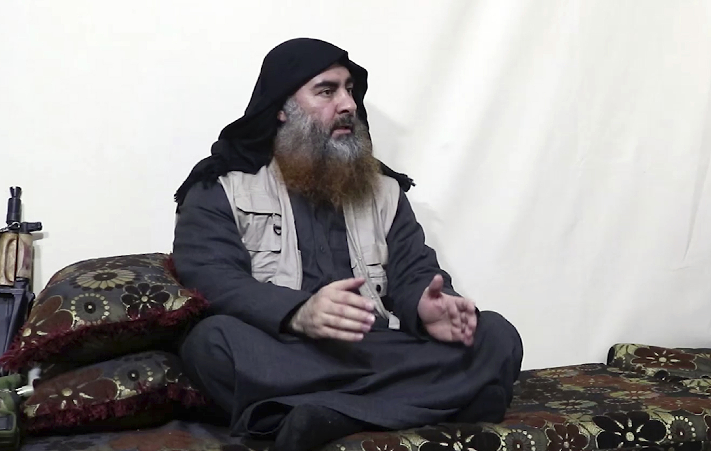 PHOTO: This image made from video posted on a militant website , April 29, 2019, purports to show the leader of the Islamic State group, Abu Bakr al-Baghdadi, being interviewed by his group's Al-Furqan media outlet. 