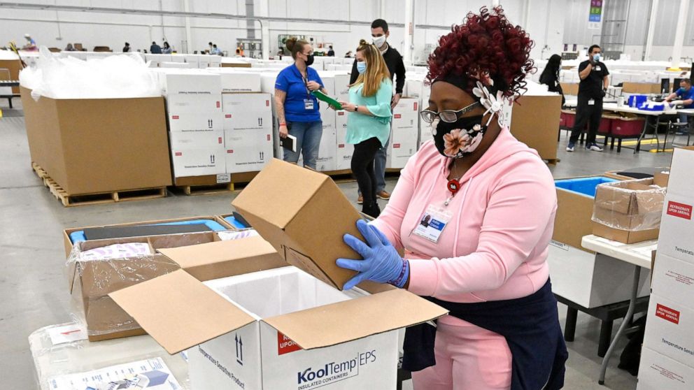 PHOTO: An employee with the McKesson Corporation packs a box of the Johnson and Johnson COVID-19 vaccine into a cooler for shipping from their facility in Shepherdsville, Ky., March 1, 2021.