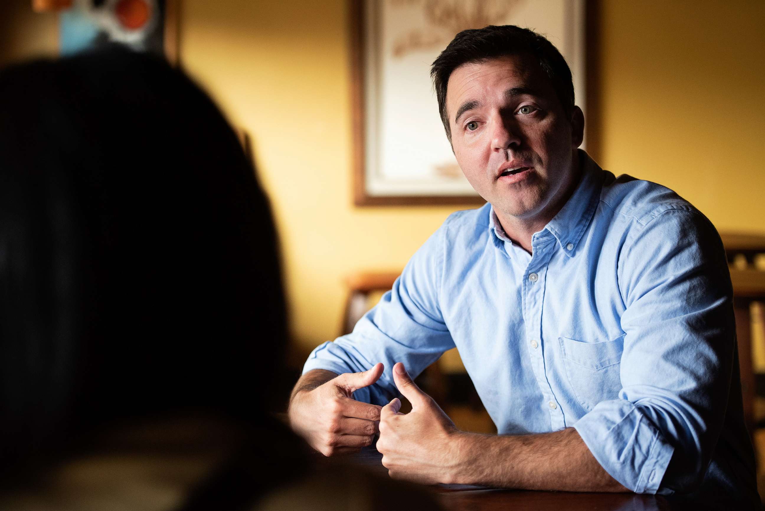 PHOTO: State Sen. Jeff Jackson, a Democratic U.S. Senate candidate, speaks with Kristin Johnson, owner of The Coffee Bar, in Hickory, North Carolina on July 8, 2021.