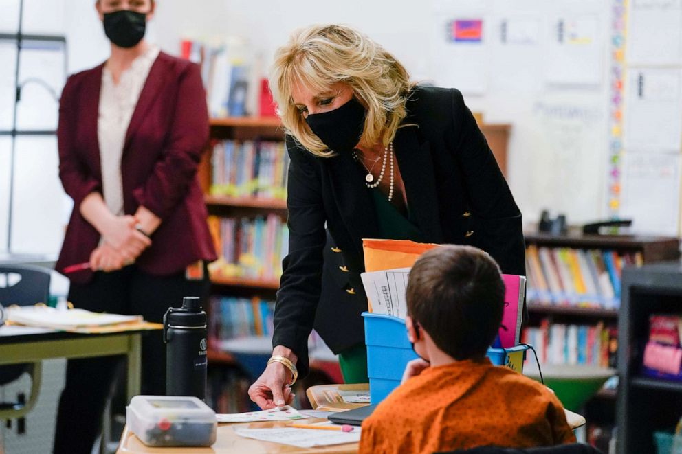 PHOTO: Jill Biden speaks to a student as she visits Christa McAuliffe School in Concord, N.H., March 17, 2021.