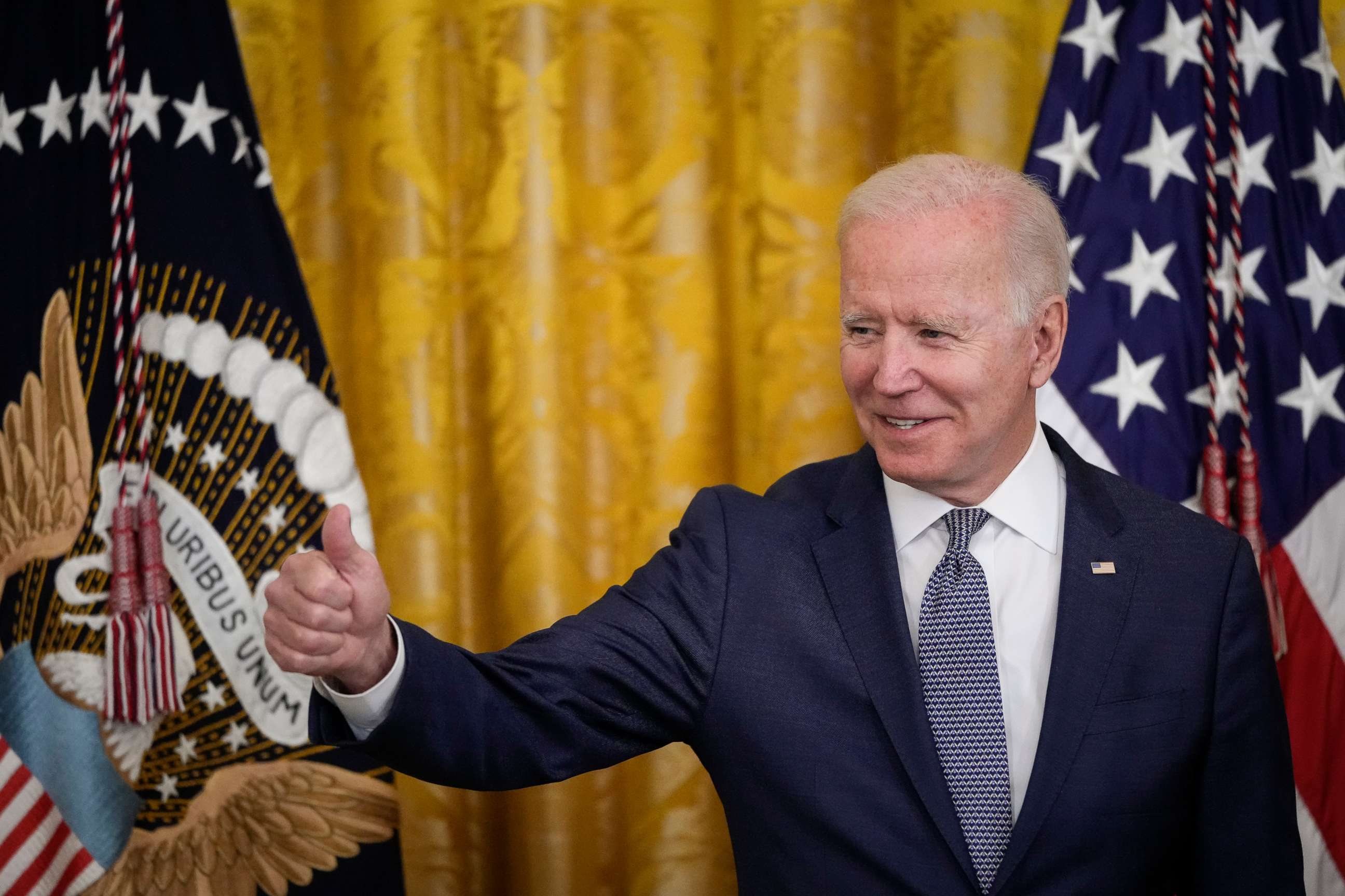 PHOTO: President Joe Biden gives the thumbs up to the audience before signing the Juneteenth National Independence Day Act into law at the White House on June 17, 2021.
