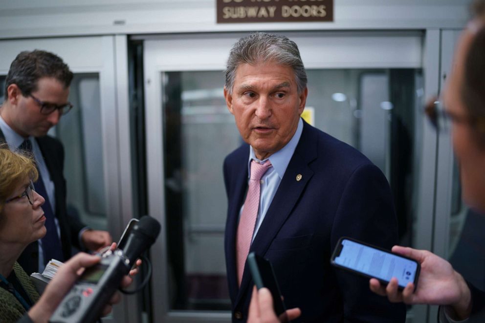 Sen. Joe Manchin, D-W.Va., talks with reporters at the Capitol in Washington on June 16, 2021.