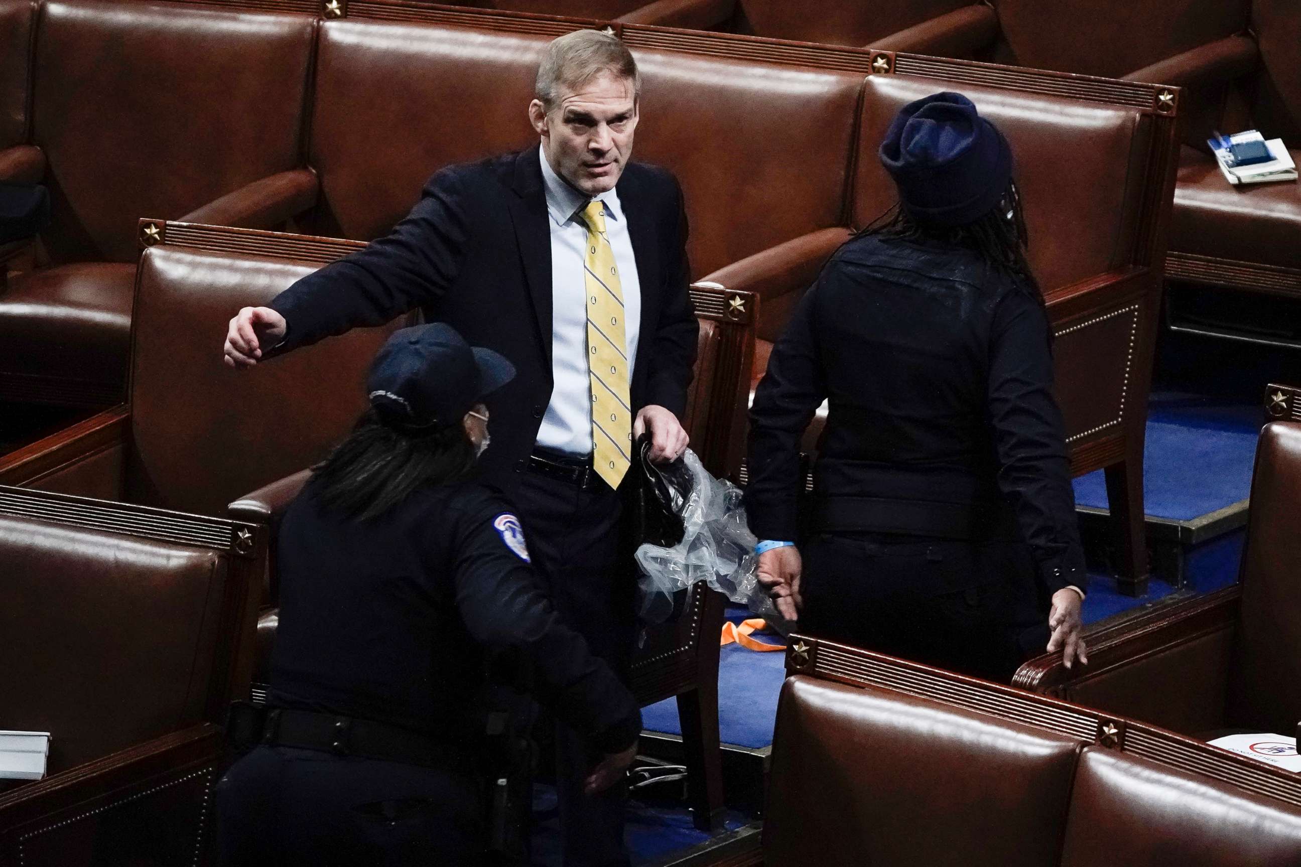 PHOTO: Rep. Jim Jordan, R-Ohio, prepares to evacuate the floor as rioters try to break into the House Chamber at the Capitol, Jan. 6, 2021.