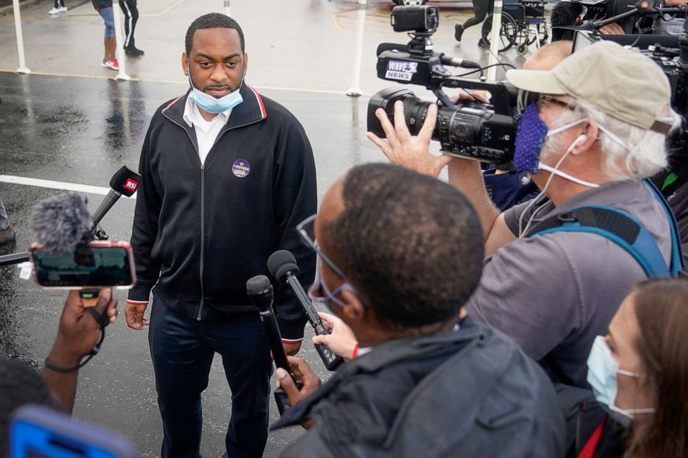 PHOTO: Kentucky State Representative and Democratic candidate for Senate Charles Booker speaks with the press outside the only primary election polling place in Louisville, Ky., June 23, 2020.