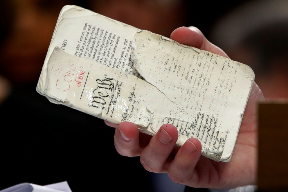 PHOTO: President Donald Trump's Supreme Court nominee, Brett Kavanaugh, a federal appeals court judge, holds up a copy of The U.S. Constitution as he testifies before the Senate Judiciary Committee on Capitol Hill in Washington, Sept. 5, 2018.