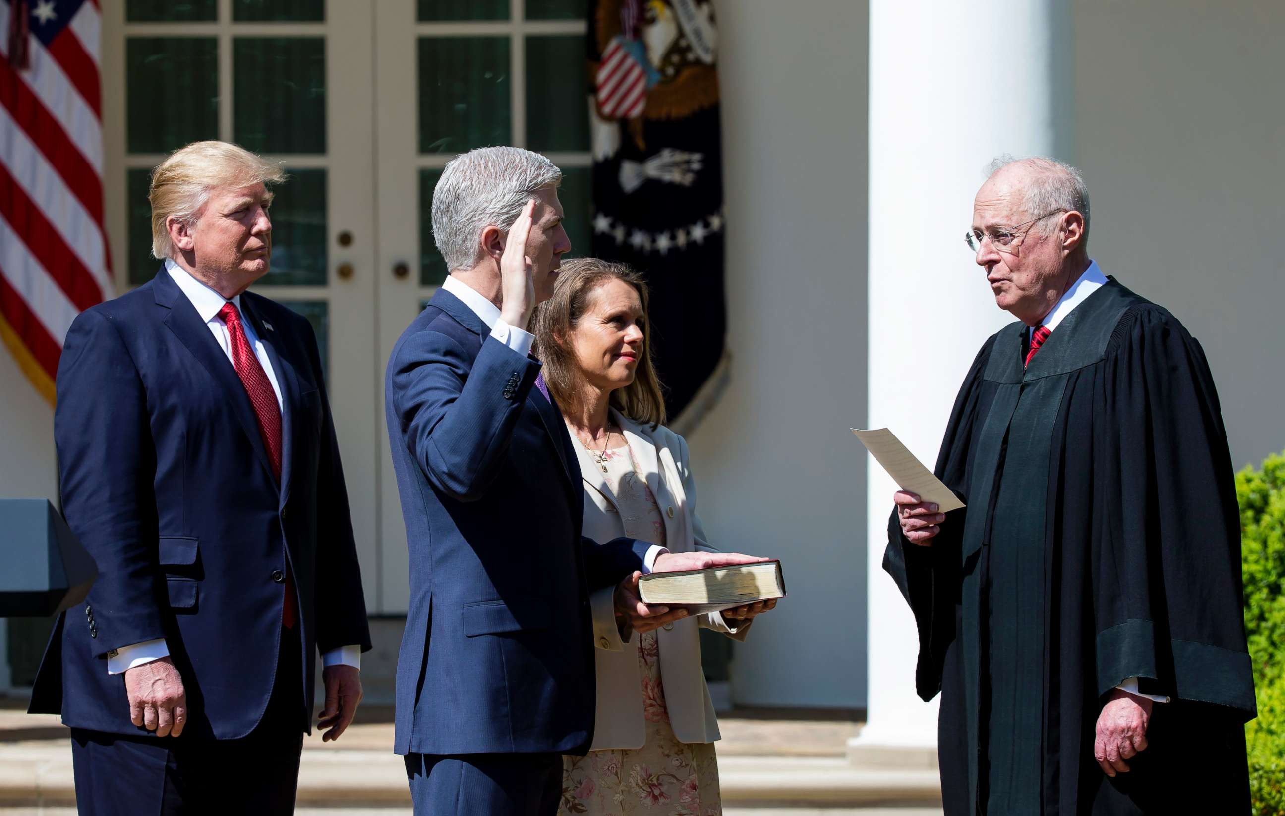 PHOTO: Supreme Court Associate Justice Anthony Kennedy administers the judicial oath to Judge Neil Gorsuch as President Donald Trump looks on during a ceremony in the Rose Garden at the White House, April 10, 2017 in Washington, D.C.
