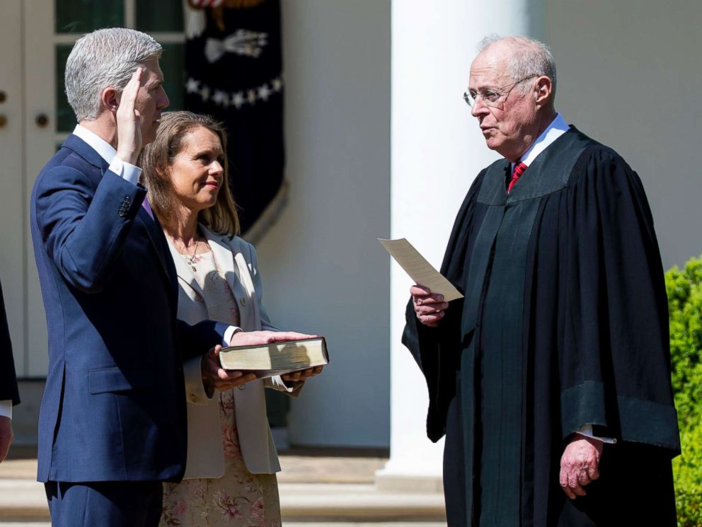 PHOTO: Supreme Court Associate Justice Anthony Kennedy administers the judicial oath to Judge Neil Gorsuch as President Donald Trump looks on during a ceremony in the Rose Garden at the White House, April 10, 2017 in Washington, D.C.