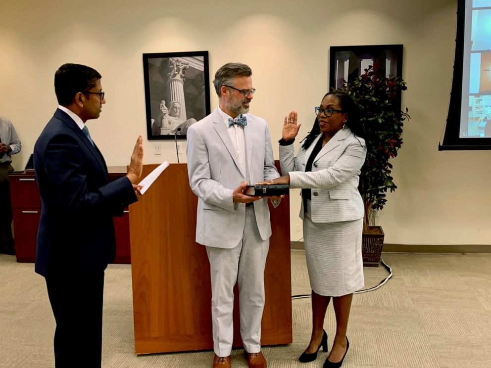 PHOTO: Ketanji Brown Jackson, right, is sworn into office by Chief Judge of the United States Court of Appeals for the District of Columbia Circuit Sri Srinivasan, left, while her husband Patrick Jackson holds a bible. 