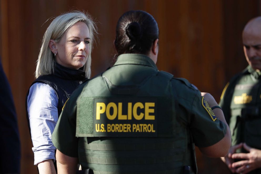 PHOTO: Department of Homeland Security Secretary Kirstjen Nielsen, left, speaks with Border Patrol agents near a newly fortified border wall structure, Oct. 26, 2018, in Calexico, Calif.