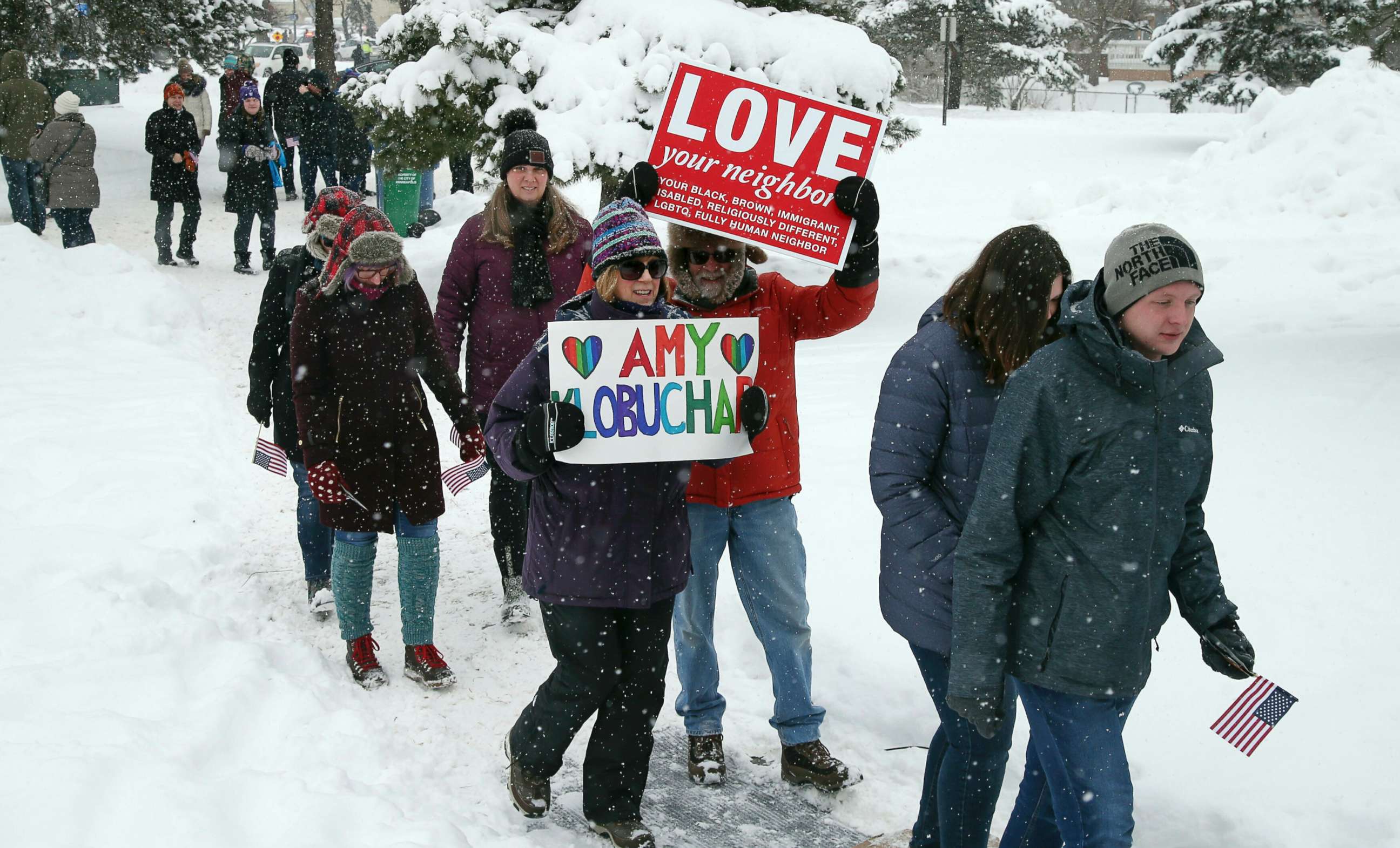 PHOTO: Snow falls as rally goers arrive at Boom Island Park for Democratic Sen. Amy Klobuchar's announcement of her decision in the race for president at a rally, Feb. 10, 2019, in Minneapolis. 