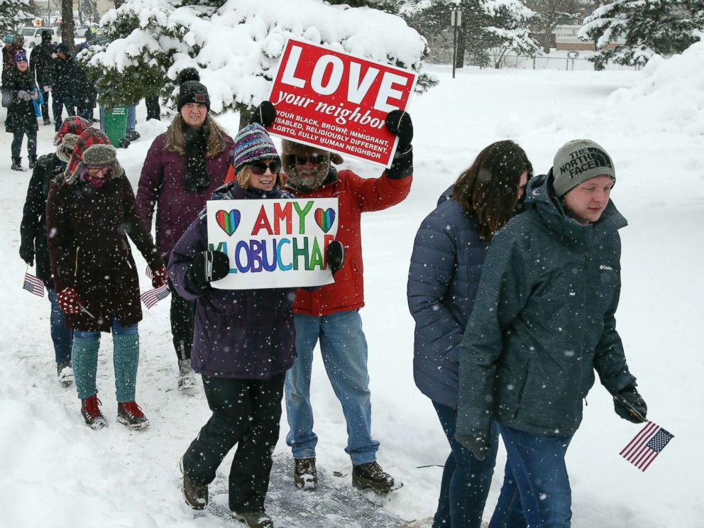 PHOTO: Snow falls as rally goers arrive at Boom Island Park for Democratic Sen. Amy Klobuchars announcement of her decision in the race for president at a rally, Feb. 10, 2019, in Minneapolis.