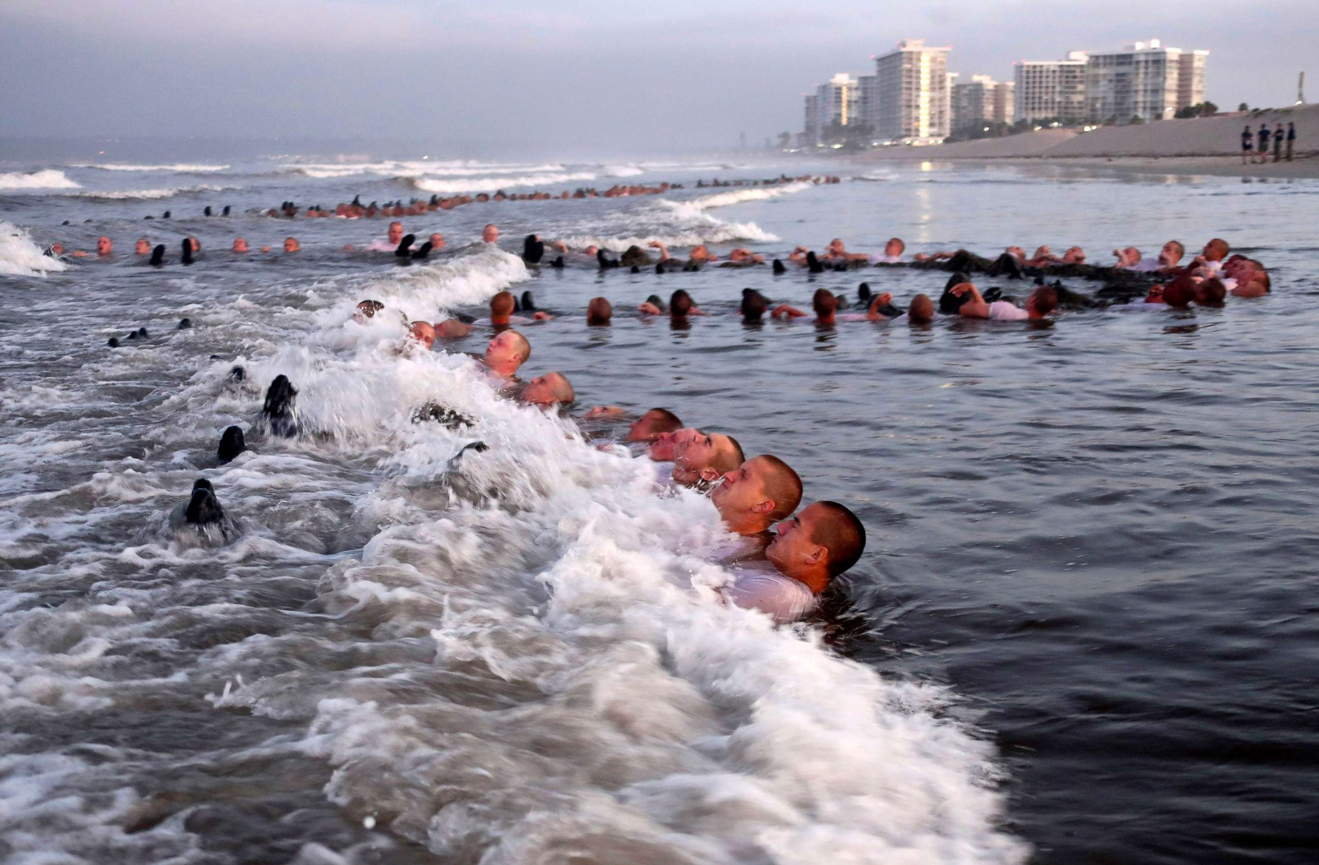 PHOTO: Navy SEAL candidates, participate in "surf immersion" during Basic Underwater Demolition/SEAL training at the Naval Special Warfare Center in Coronado, Calif.,  May 4, 2020.