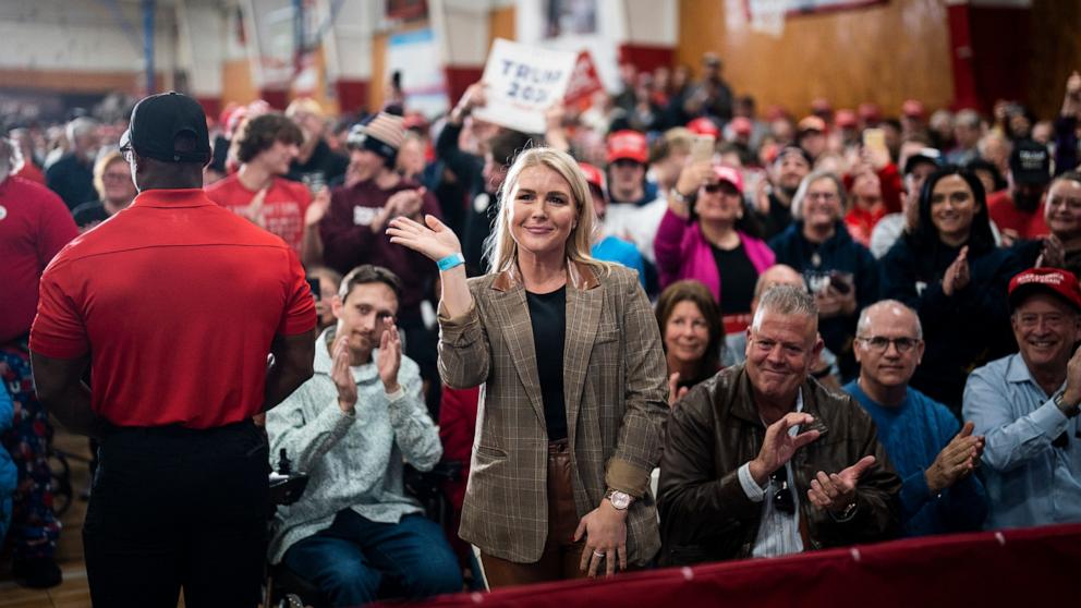 PHOTO: Karoline Leavitt waves as former President Donald Trump speaks at a campaign rally, Oct. 23, 2023, in Derry, N.H. 