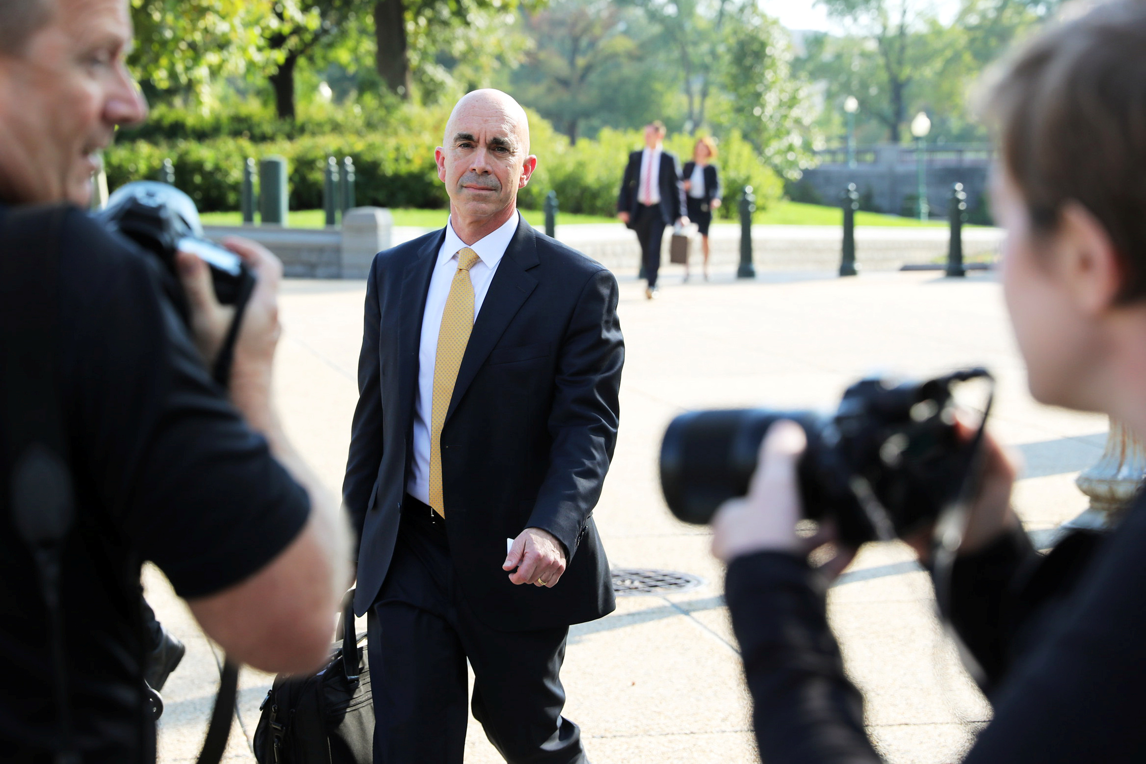 PHOTO: State Department Inspector General Steve Linick is surrounded by news photographers as he departs after briefing House and Senate Intelligence committees at the Capitol, Oct. 2, 2019. 