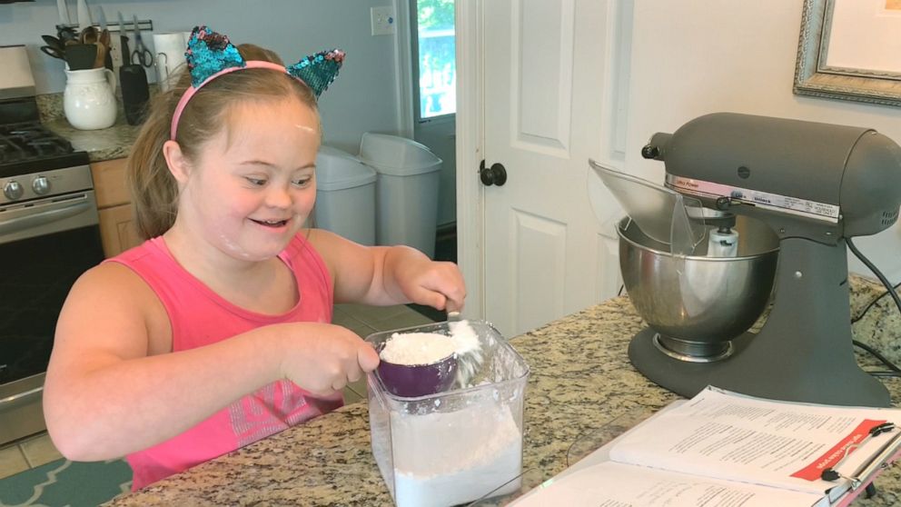 PHOTO: 11-year-old Moriah Winchell of Bridgewater, Mass., is baking with her parents to learn math skills while at home during the pandemic.