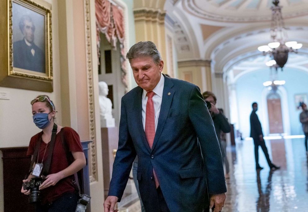 PHOTO: Sen. Joe Manchin walks to a caucus lunch at the Capitol, Dec. 17, 2021.