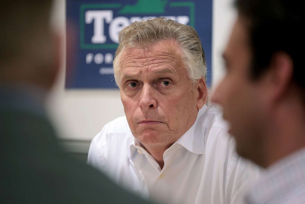 PHOTO: Democratic gubernatorial candidate, former Virginia Gov. Terry McAuliffe speaks with local business owners during a business roundtable campaign event, Oct. 20, 2021, in Charlottesville, Va. 
