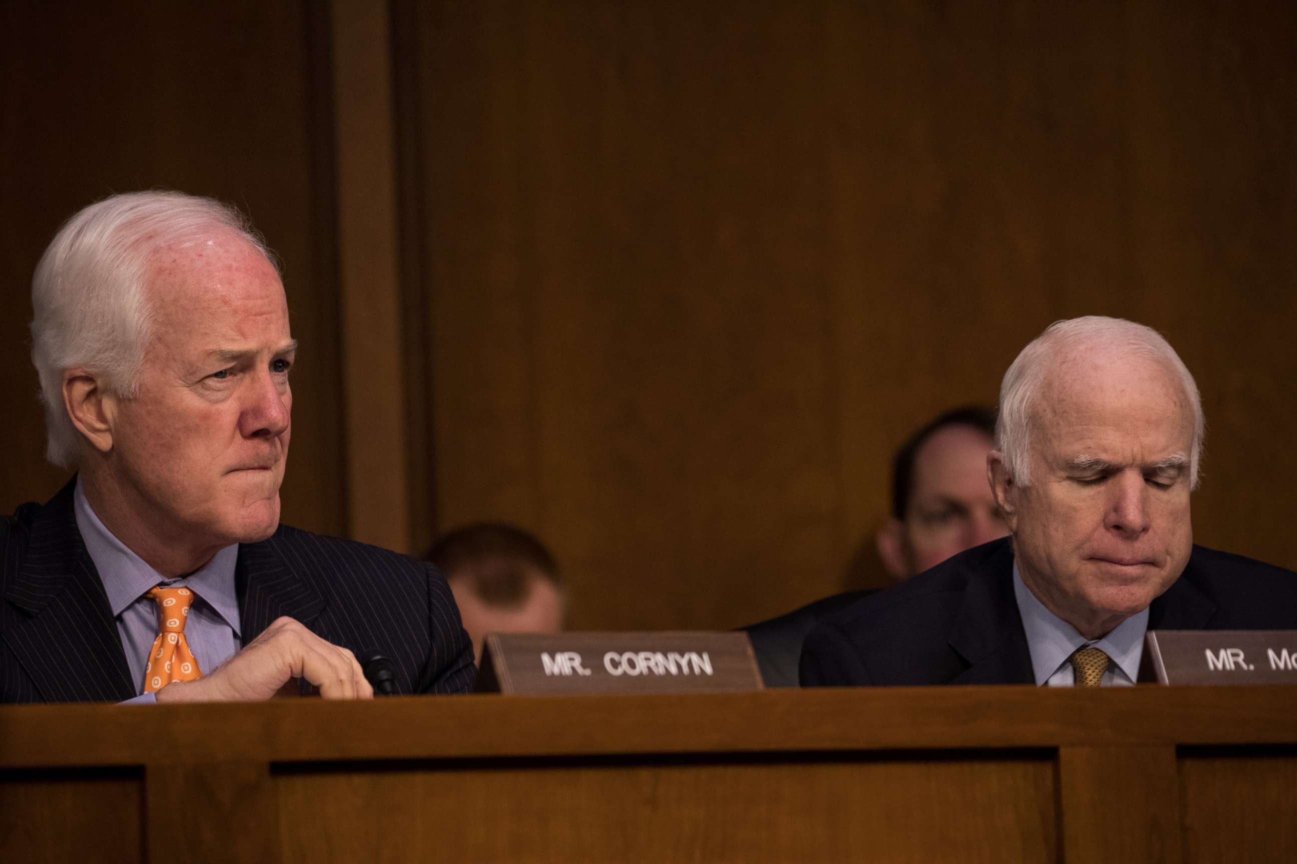 PHOTO: Sen. John Cornyn (R-TX), and Sen. John McCain (R-AZ), listened as former FBI Director James Comey testified in front of the Senate Intelligence Committee, June 8, 2017. 