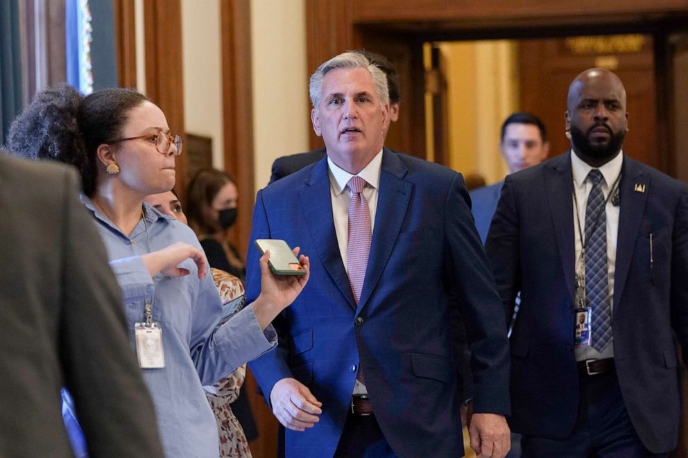 PHOTO: House Minority Leader Kevin McCarthy, is followed by reporter as he walks to his office on Capitol Hill, Aug. 12, 2022. 