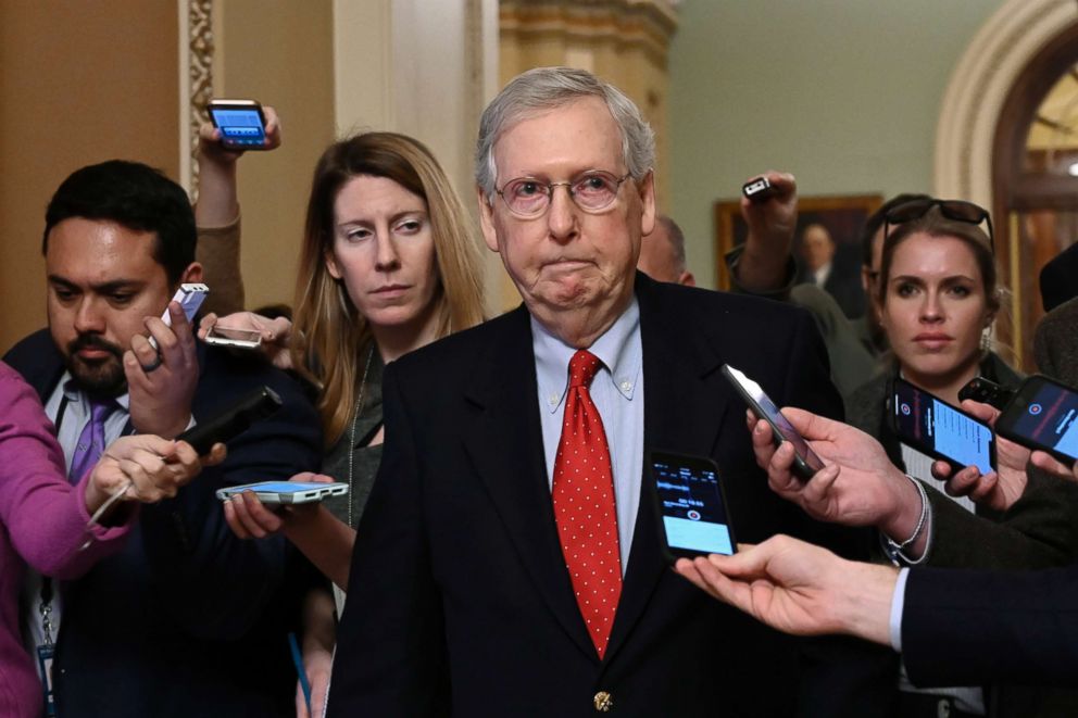 PHOTO: Senate Majority Leader Mitch McConnell of Ky., center, talks with reporters as he walks on Capitol Hill, Jan. 2, 2019.