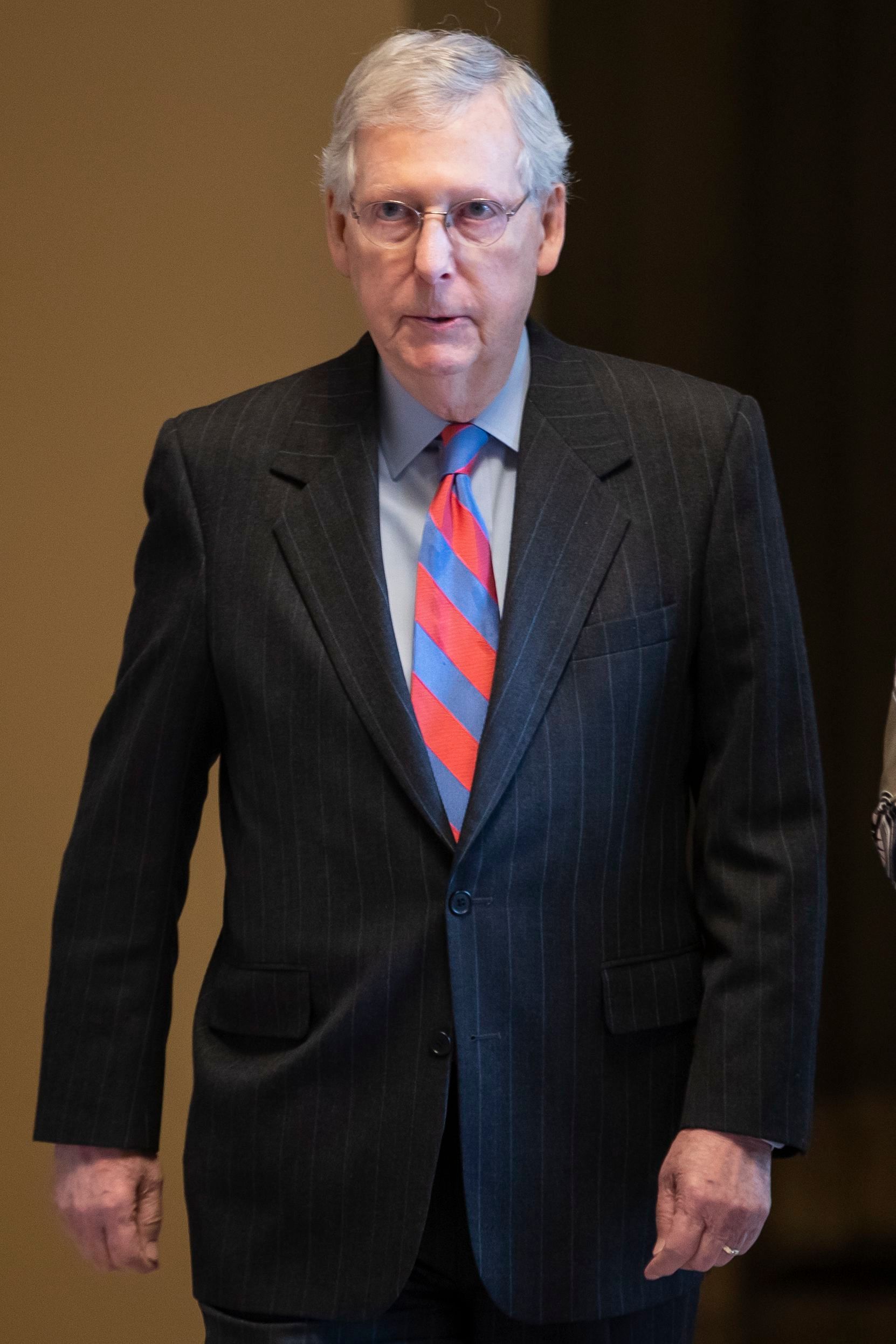 PHOTO: Senate Majority Leader Mitch McConnell walks onto the Senate floor at the Capitol, Feb. 14, 2019. 